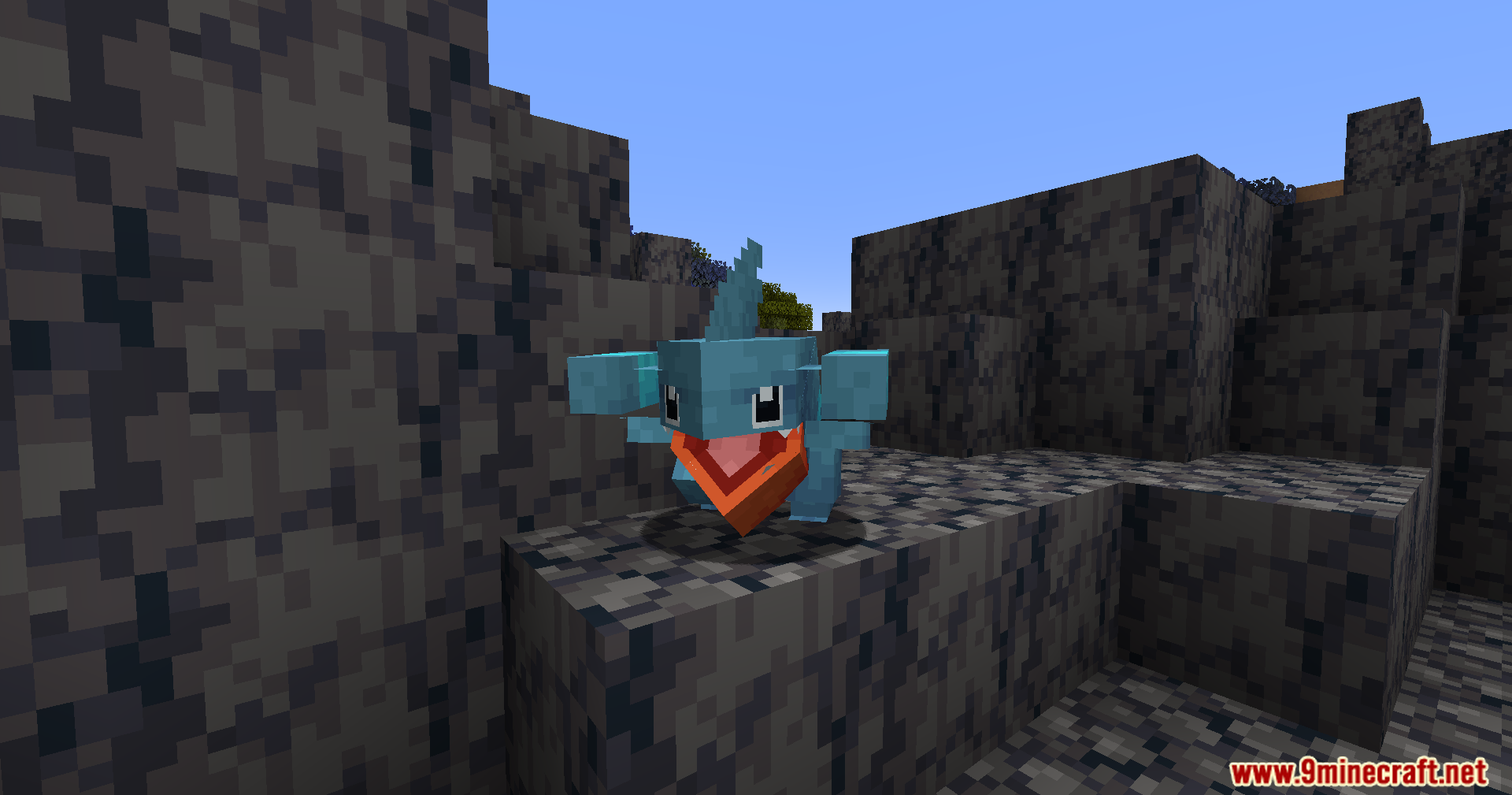 Cobble Safari Mod Screenshot 15 A blue Gible creature stands on a rocky ledge in a Minecraft world