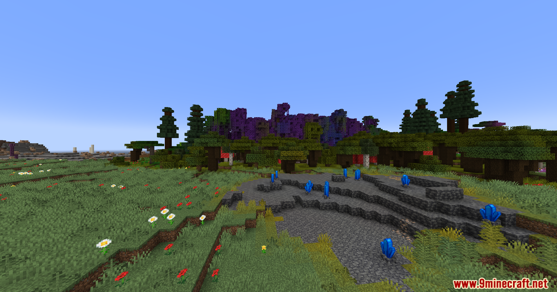 Cobble Safari Mod Screenshot 7 Blue crystals grow on stone ground near a forest of purple trees