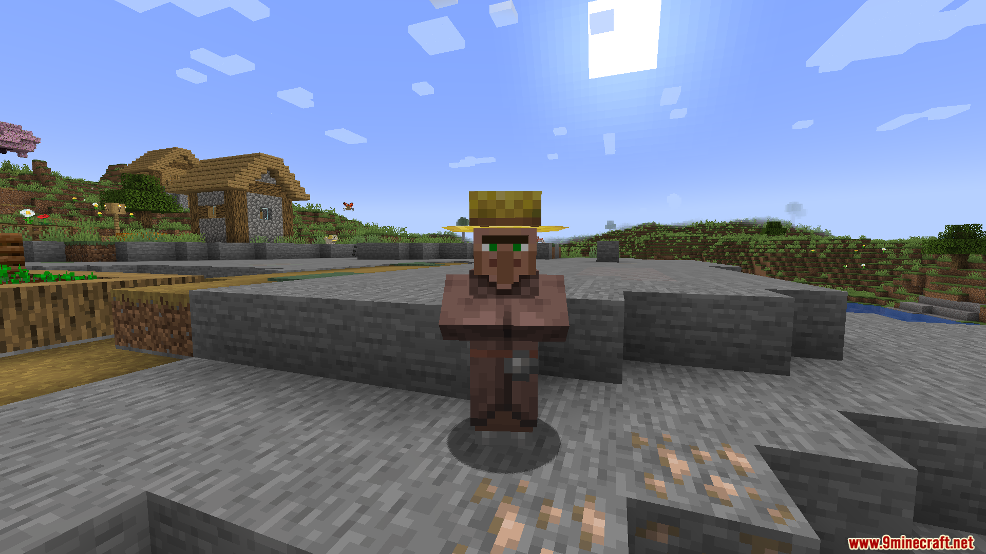 Cobblemon Villager Overhaul Mod Screenshot 4 A farmer villager standing in a village area with stone ground and hills