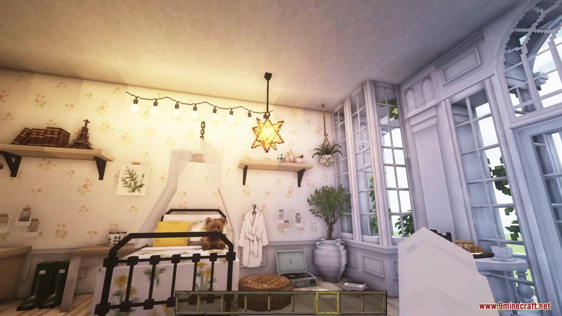 A cozy bedroom featuring a star-shaped hanging light and floral wallpaper