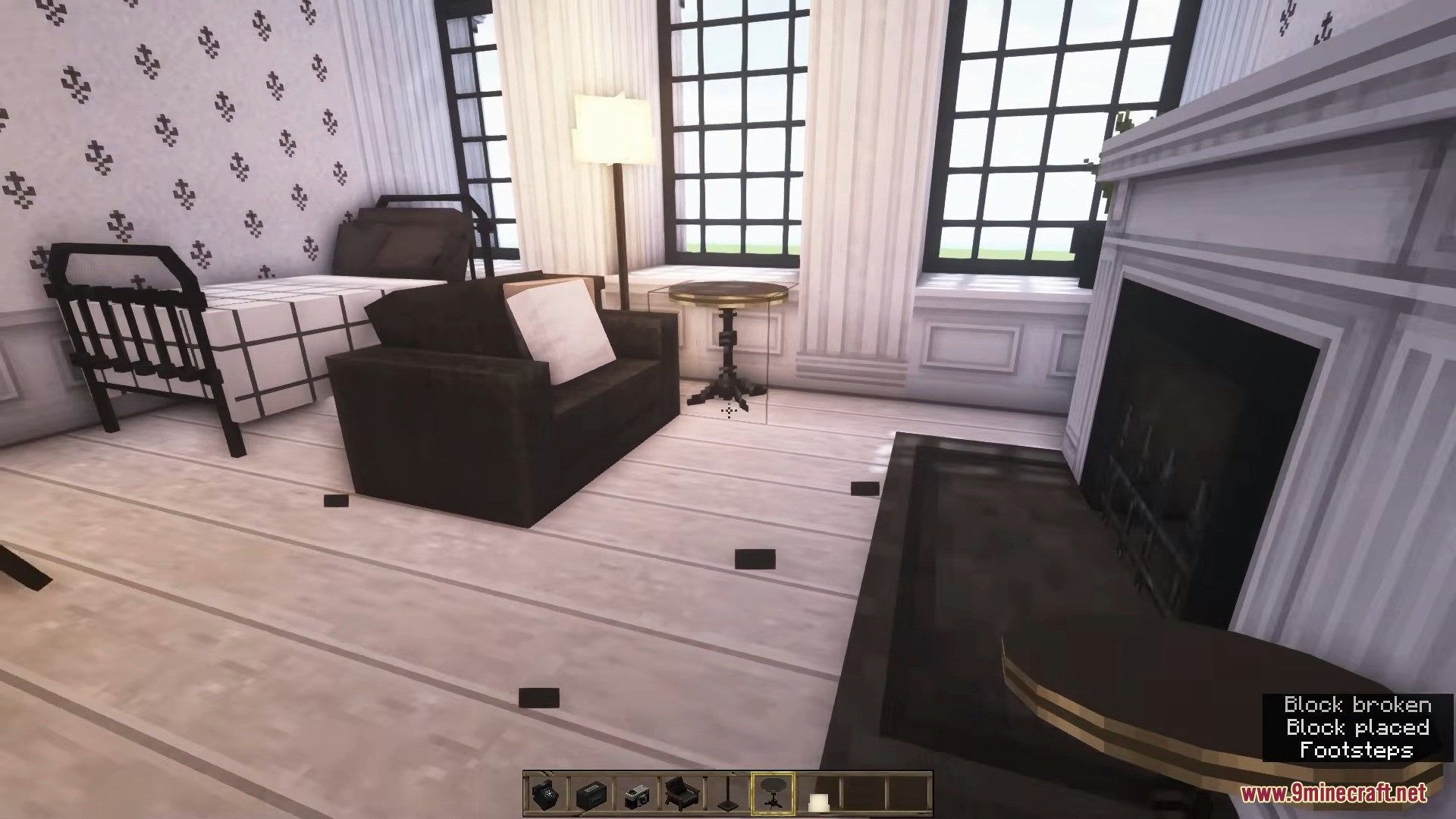 A cozy living room layout featuring a dark armchair and a fireplace