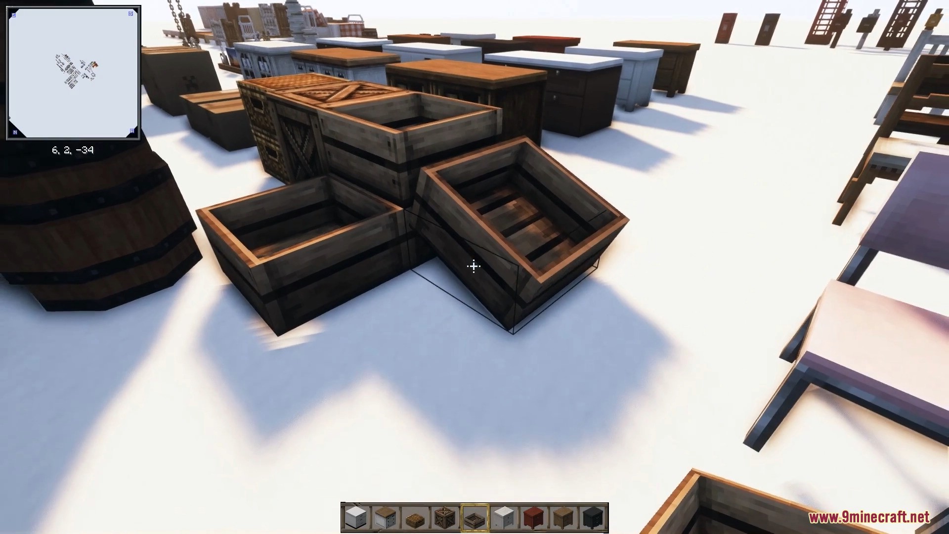 Empty wooden crates stacked neatly beside a large rustic barrel.