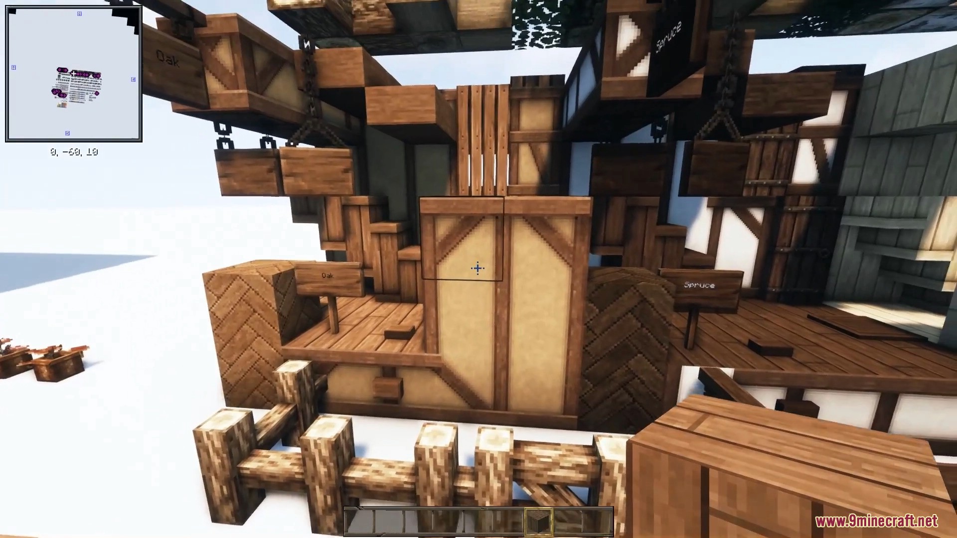 Various wooden beams, fences, and textured blocks highlight realistic building materials.