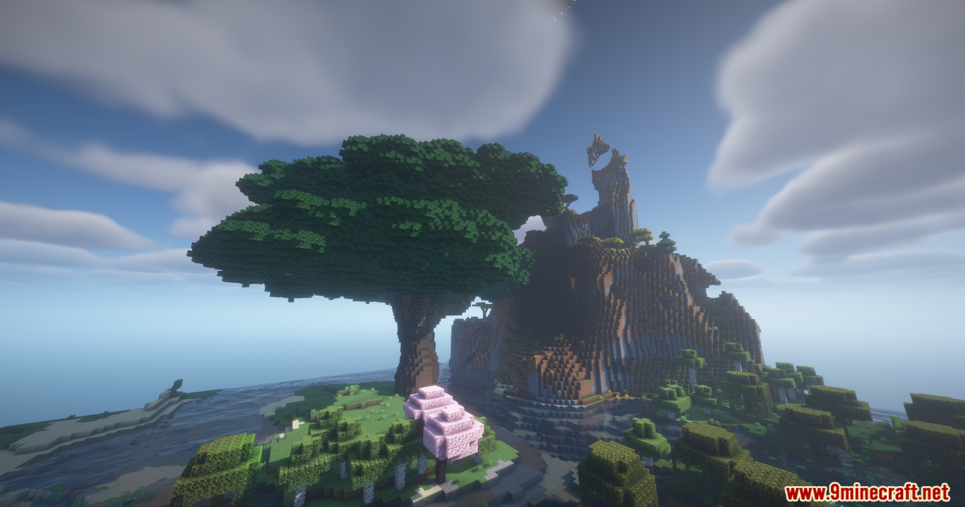 Confluence Music Mod Screenshot 3 A giant tree and pink cherry blossoms near a mountain in Minecraft