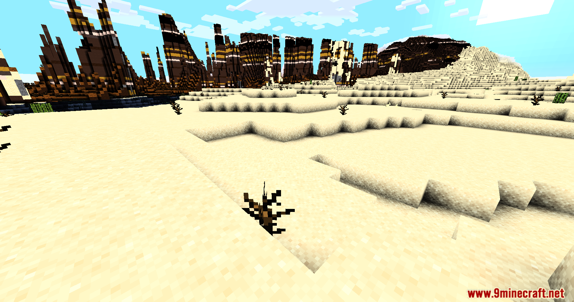 High contrast lighting effects over a desert biome with tall terracotta pillars