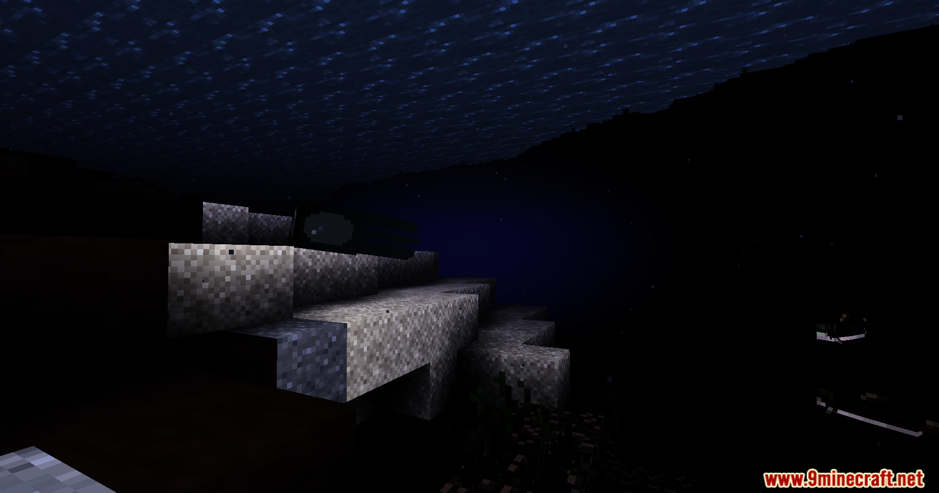 Stone blocks barely visible in a pitch black environment under a dark sky