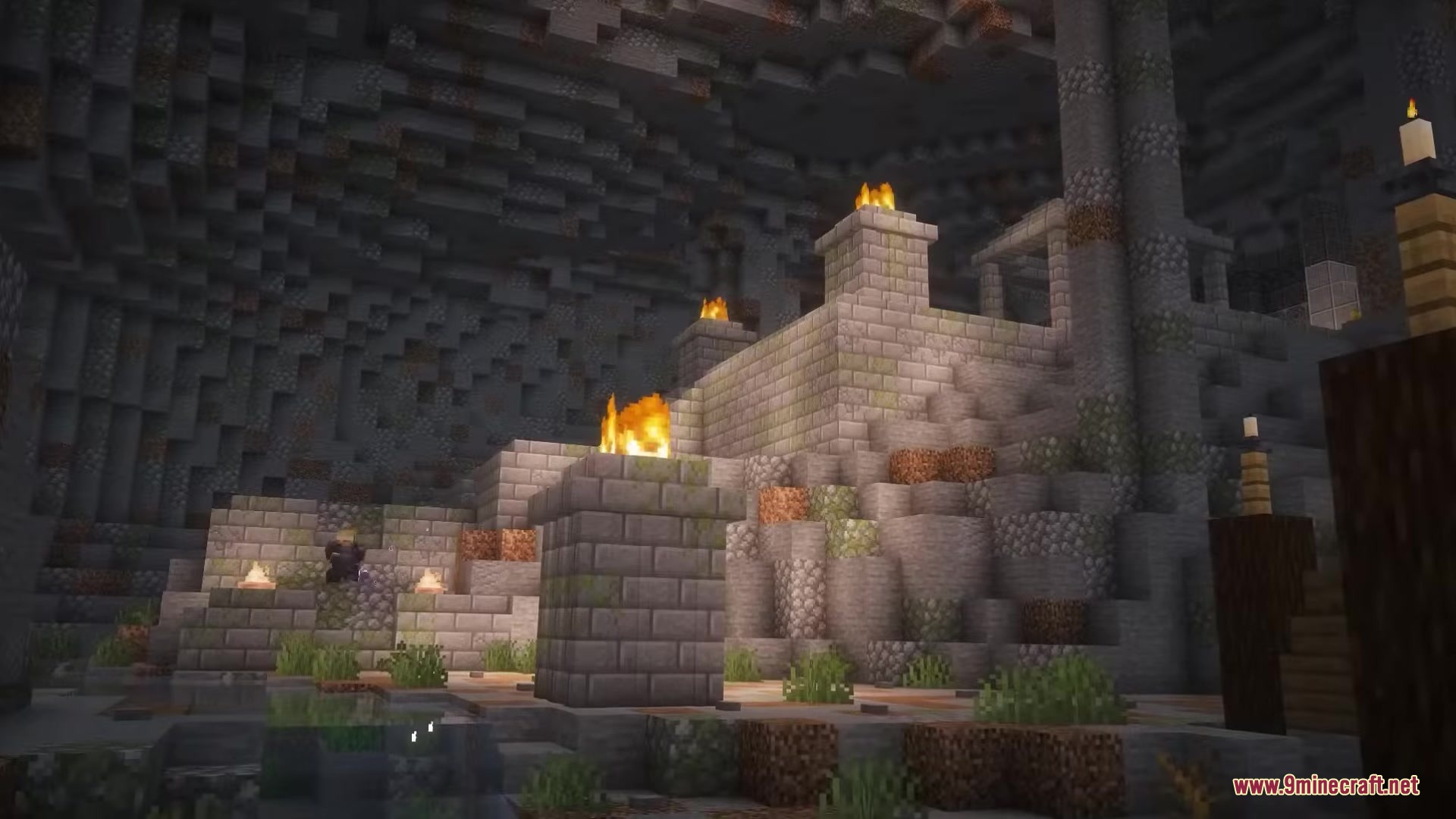 Dark Fantasy Nordic Tombs Mod Screenshot 8 Ancient stone ruins with lit torches located deep within a dark cave