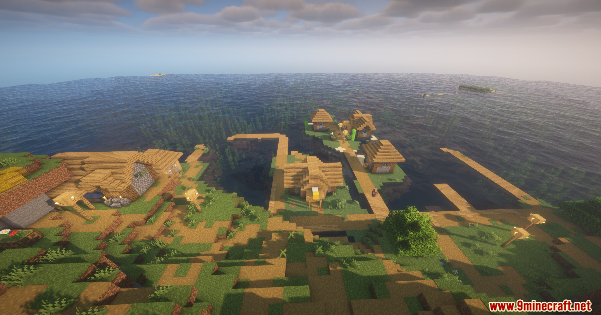 Disable Fog Mod Screenshot 5 A peaceful coastal village in Minecraft with clear water and wooden structures
