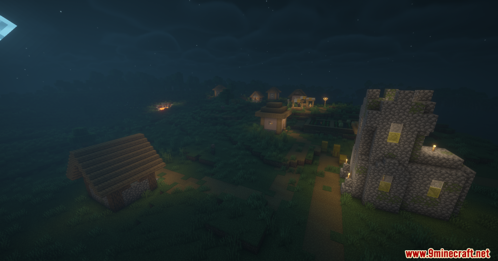 Disable Fog Mod Screenshot 8 A peaceful village at night featuring a cobblestone church and lit houses