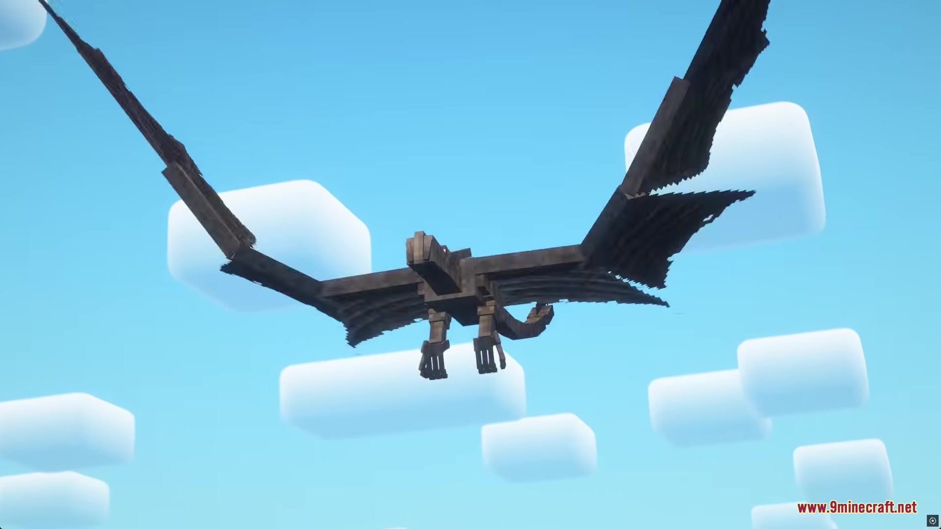 A giant dark dragon spreads its wings while flying through the clear sky