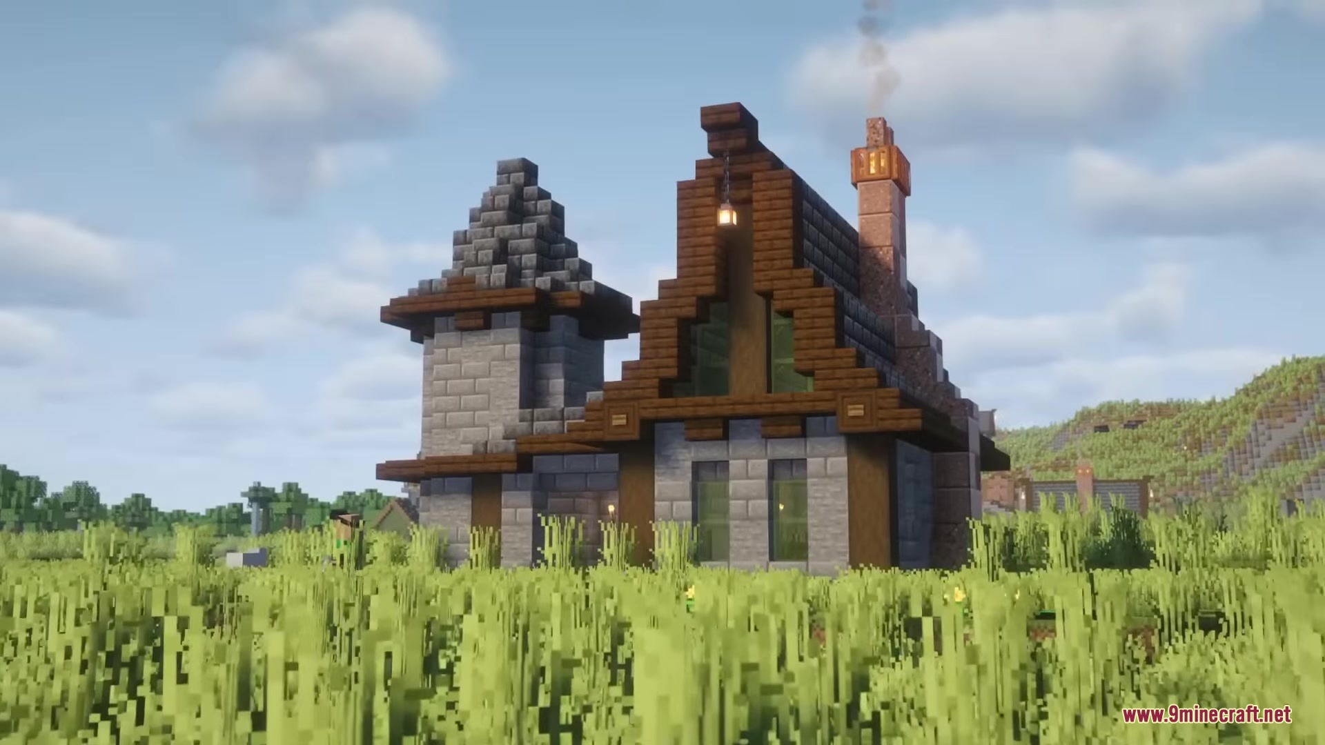 Drifter Mod Screenshot 16 A medieval style house with a smoking chimney sits in a grassy field