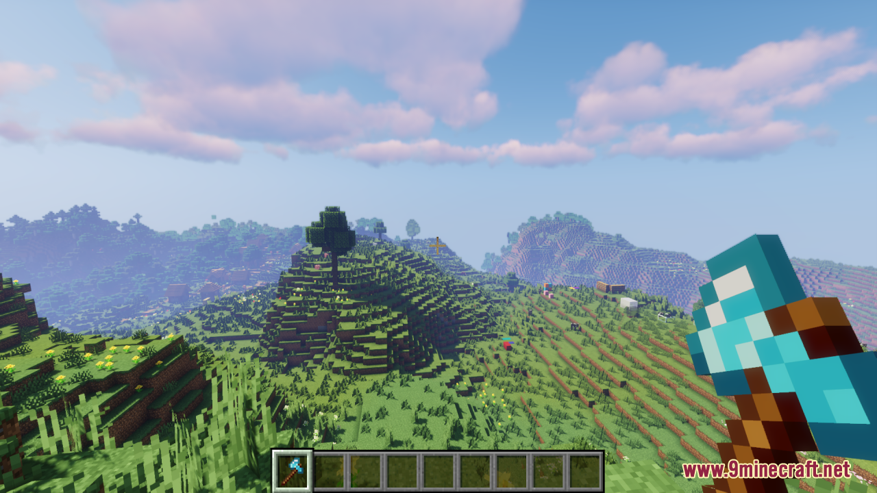 Drodi's Arsenal Resource Pack Screenshot 6 First person view of a player holding a blue axe in a field