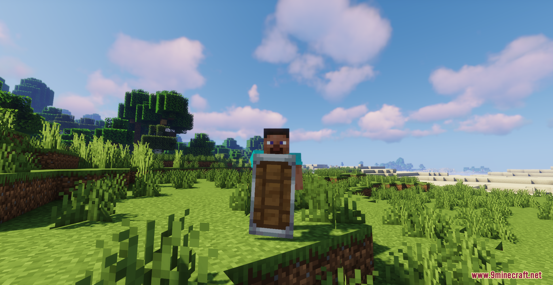 Drodi's Shield Resource Pack Screenshot 5 A Minecraft player blocks with a wooden shield in a sunny grassy field