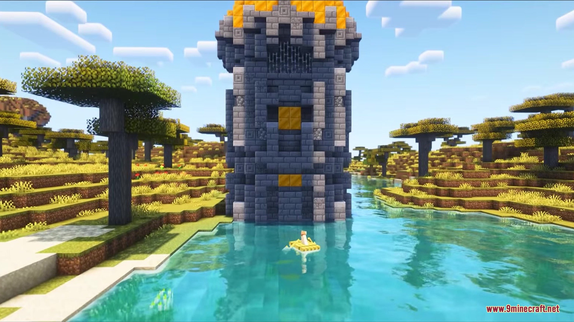 A tall stone tower with gold accents stands in a river savanna biome