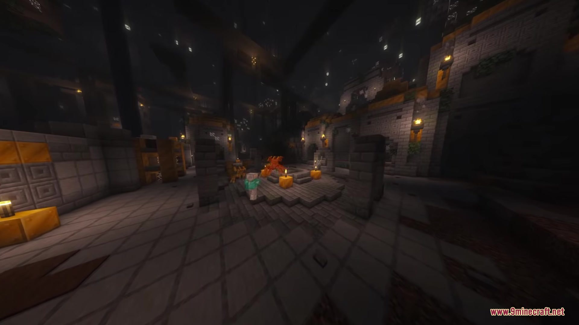A mechanical spider stands near candles in a dark underground stone ruin