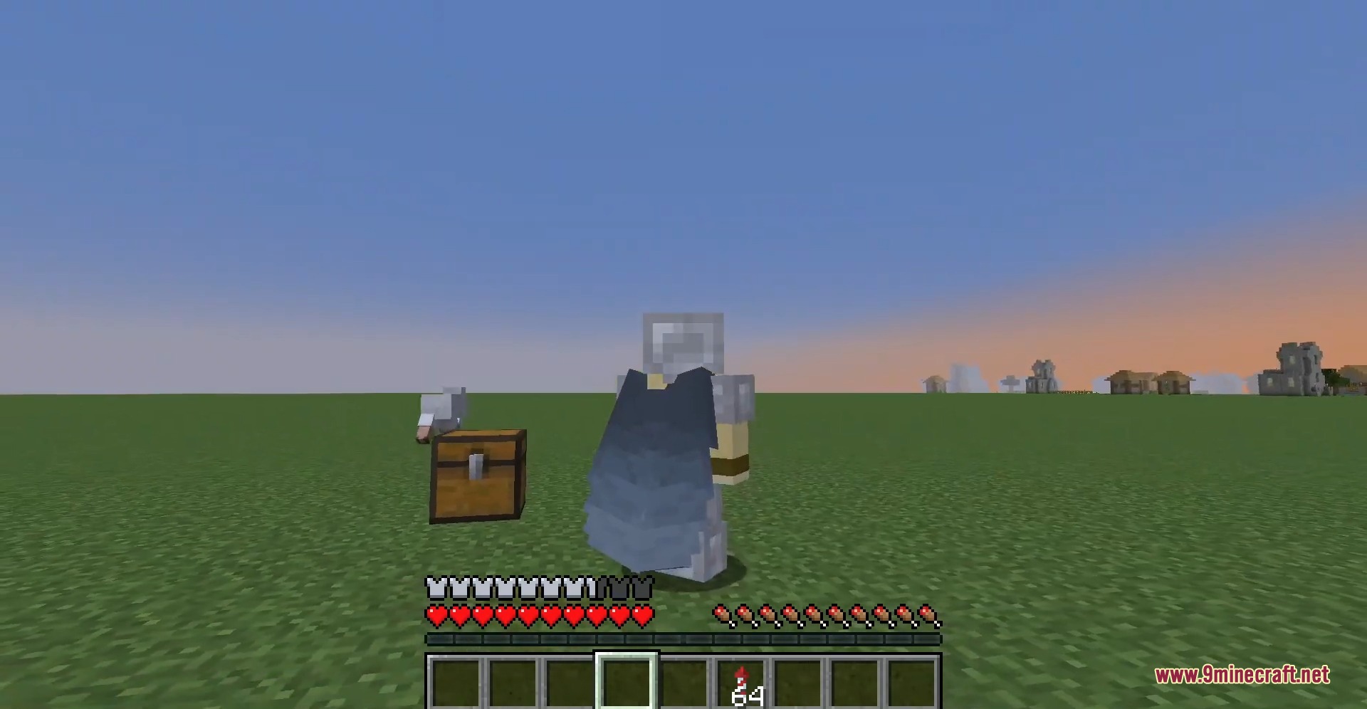 Minecraft player wearing iron armor and an elytra together near a wooden chest