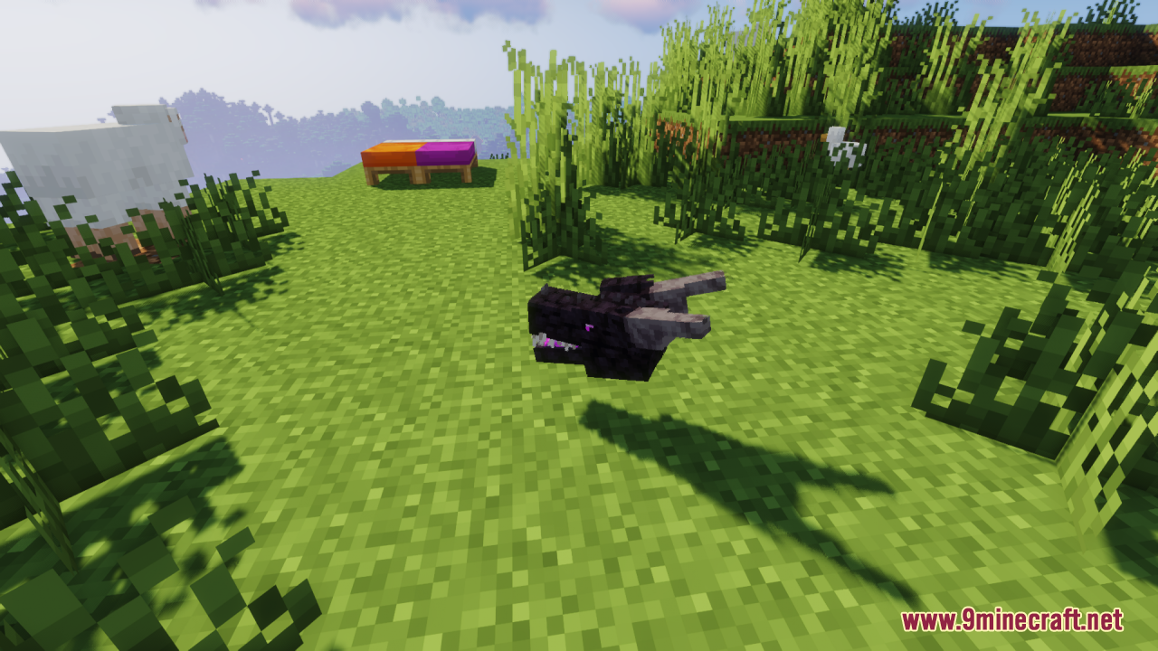 A detailed Ender Dragon head model floating over a grassy Minecraft field