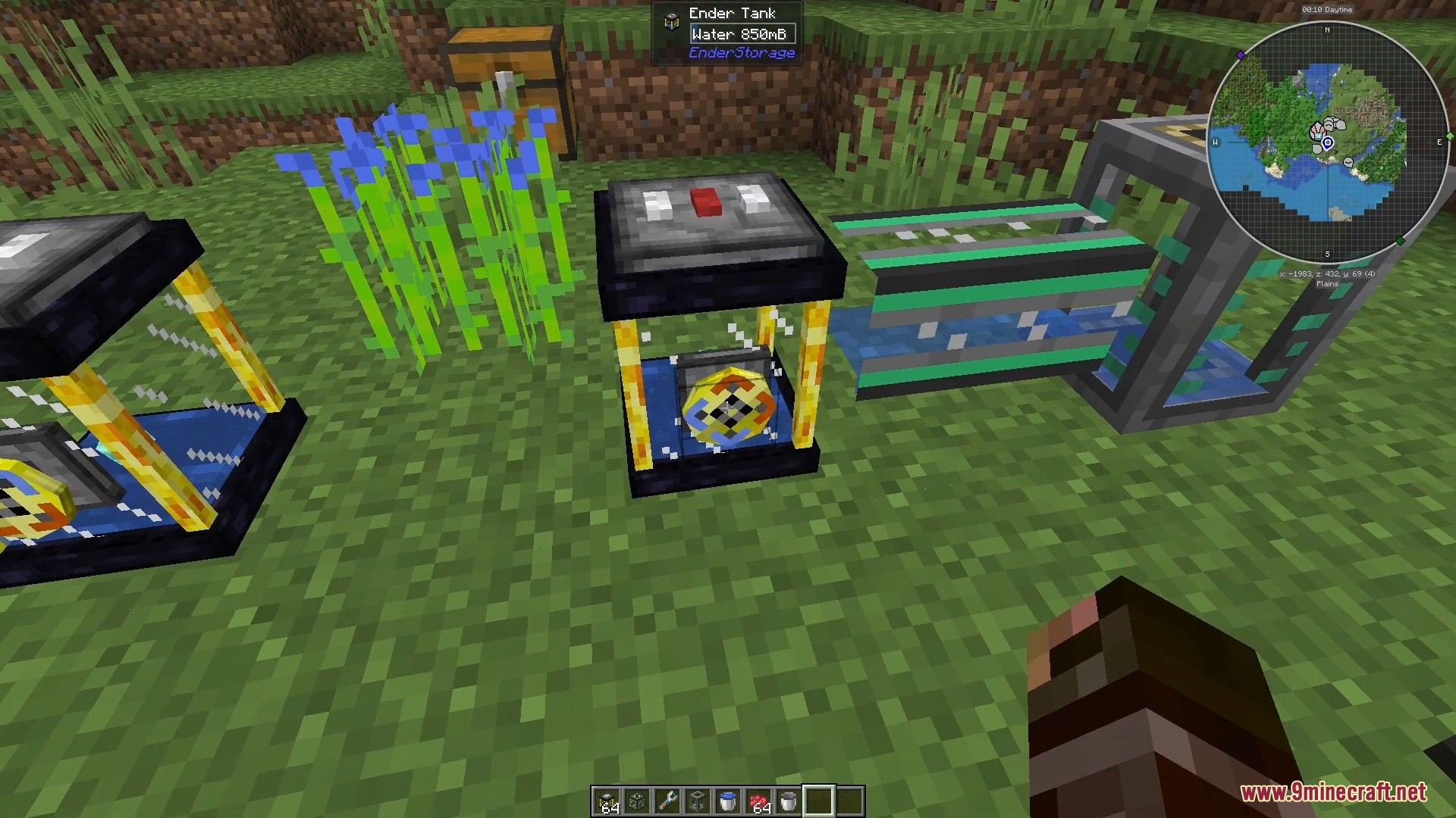 An Ender Tank storing water connected to pipes in a grassy field