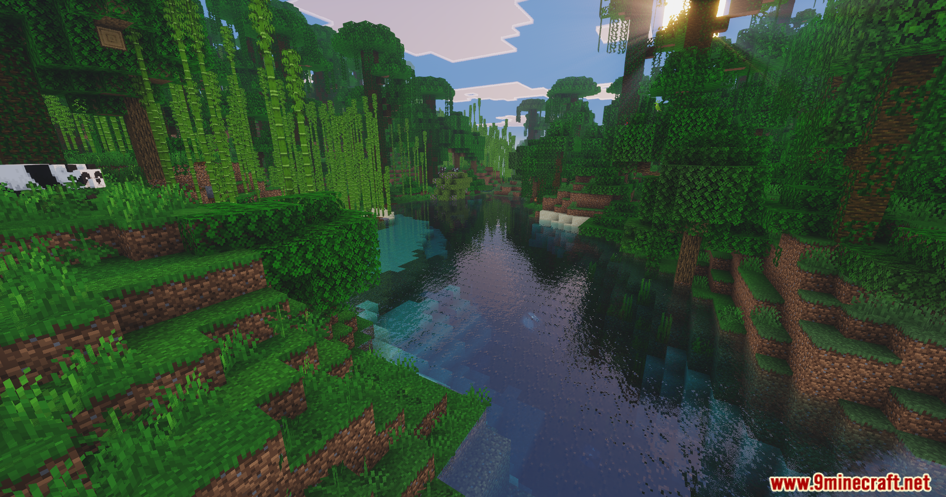 A panda rests near a river with realistic water reflections in the jungle