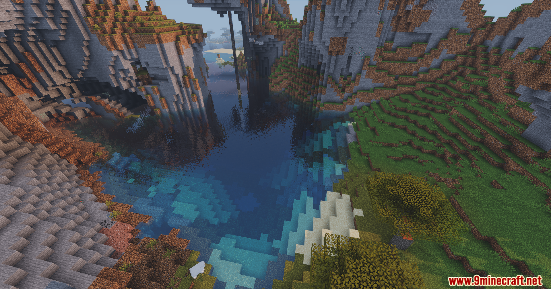 Enhanced Vibrance Edition Shaders showing a scenic mountain bay with realistic water reflections
