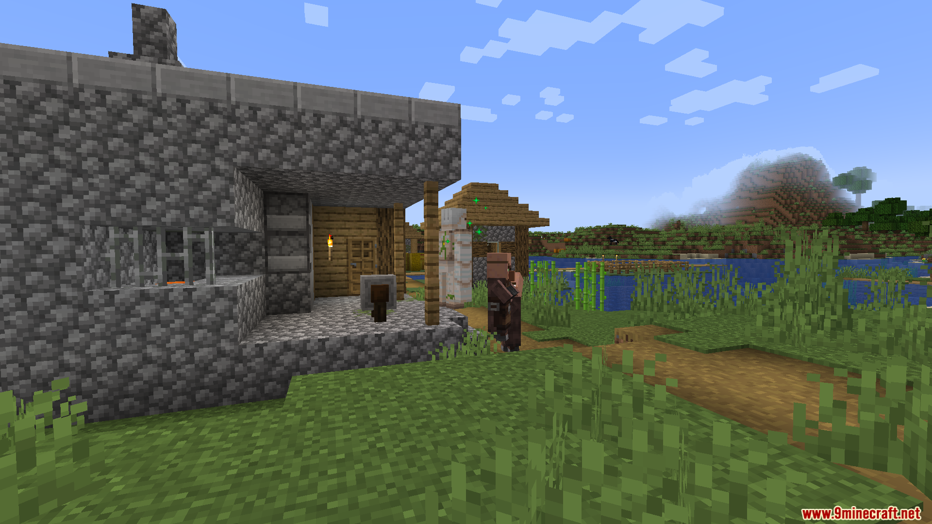 Enough Visuals Mod Screenshot 3 An iron golem and a villager stand near a large cobblestone building