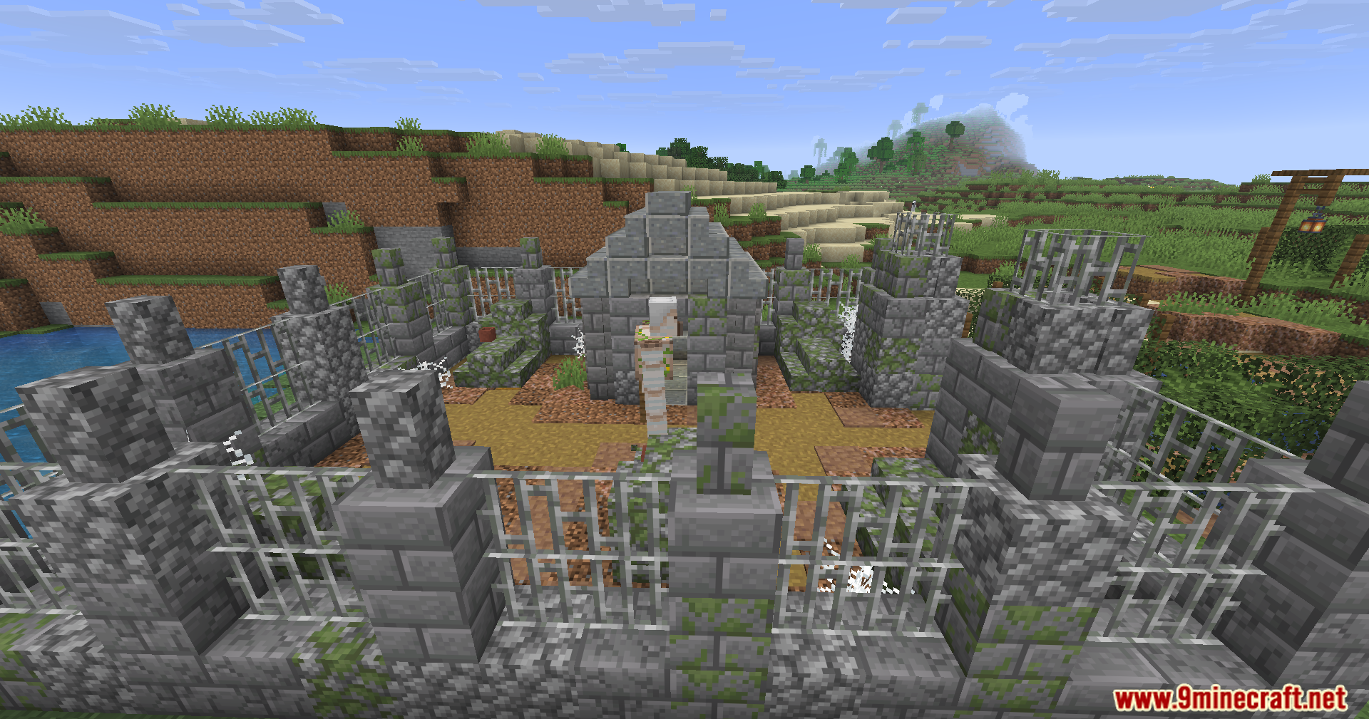 Epic Structures Villages Mod Screenshot 11 A detailed stone graveyard structure with an Iron Golem standing inside