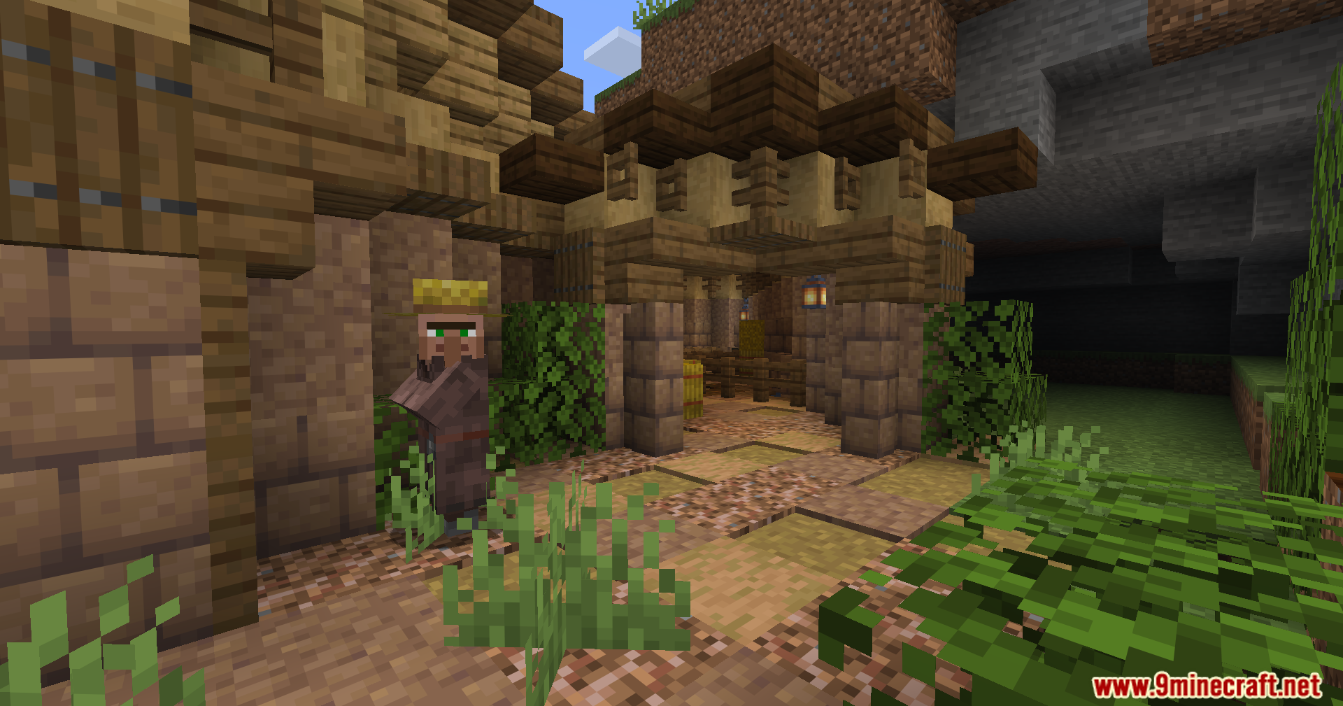 Epic Structures Villages Mod Screenshot 14 A villager stands near a stone archway entrance in a medieval town