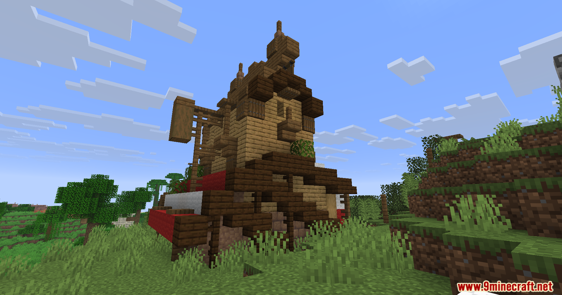 Epic Structures Villages Mod Screenshot 15 A detailed wooden house with a complex roof design in a grassy field