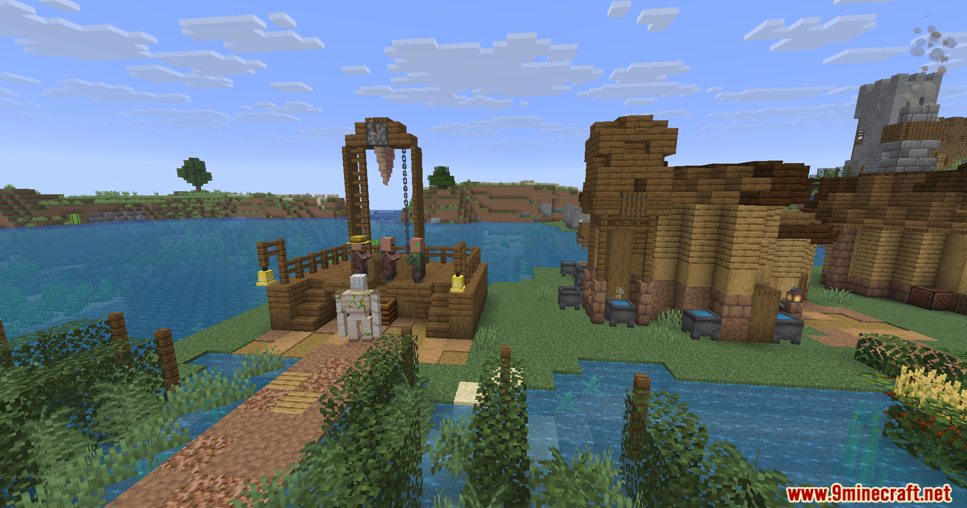 Epic Structures Villages Mod Screenshot 2 Villagers standing on a wooden platform near a medieval house and lake