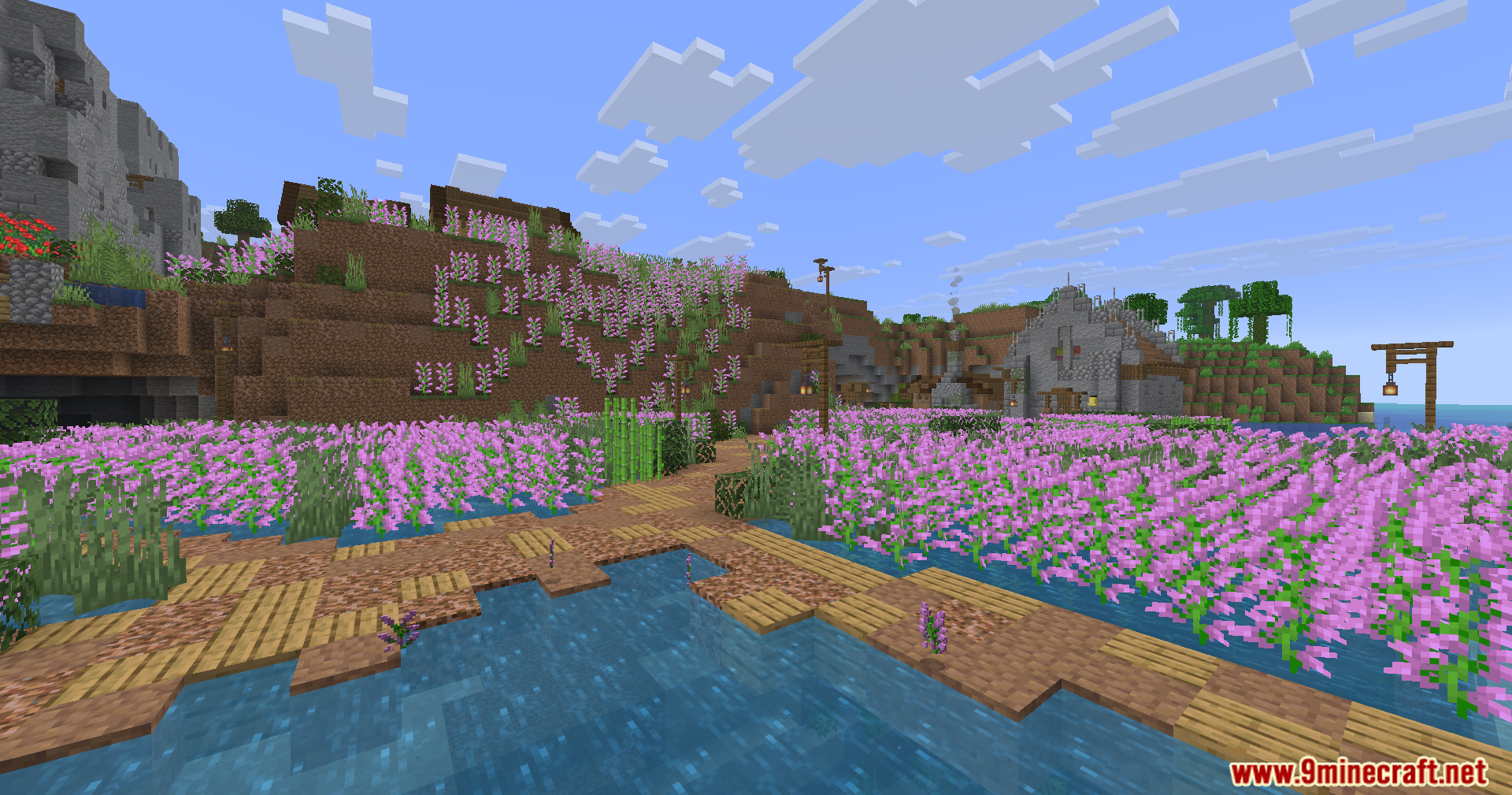 Epic Structures Villages Mod Screenshot 3 Pink flowers form a heart shape on a hill near a stone building