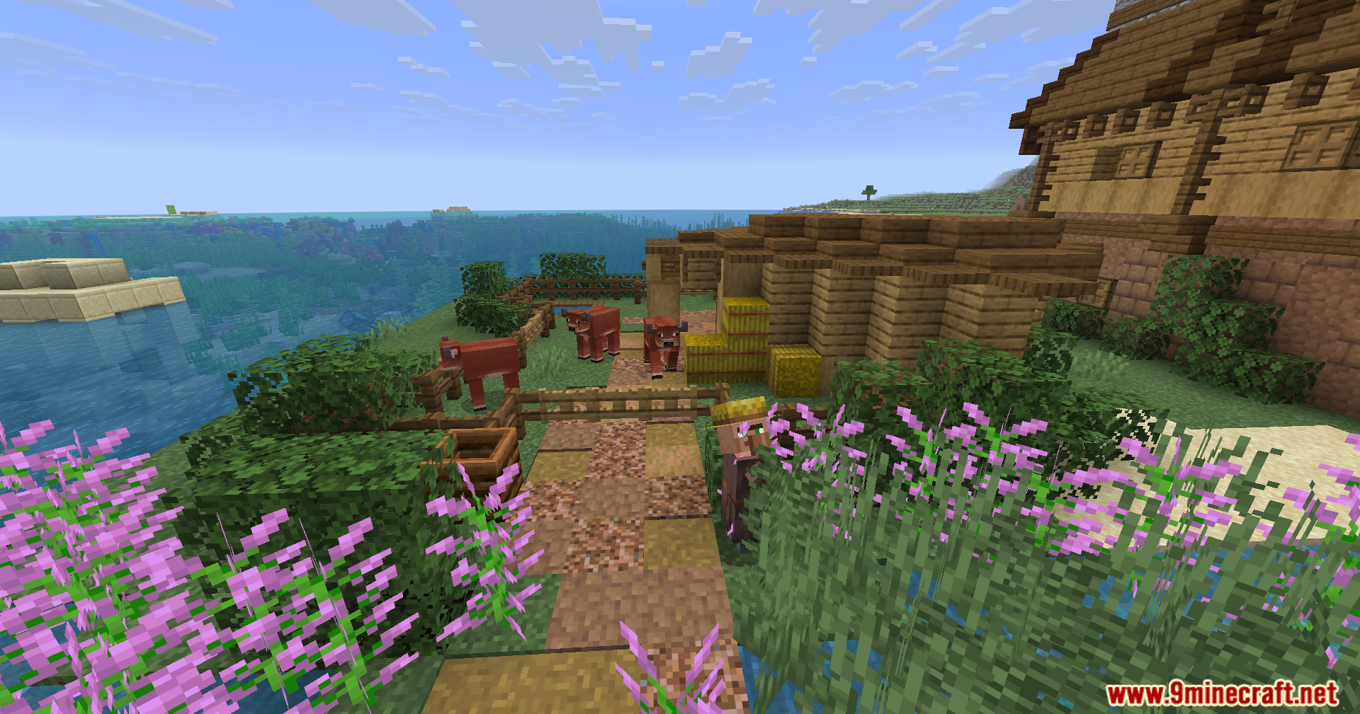 Epic Structures Villages Mod Screenshot 4 Brown cows graze in a fenced pen near a wooden farm house