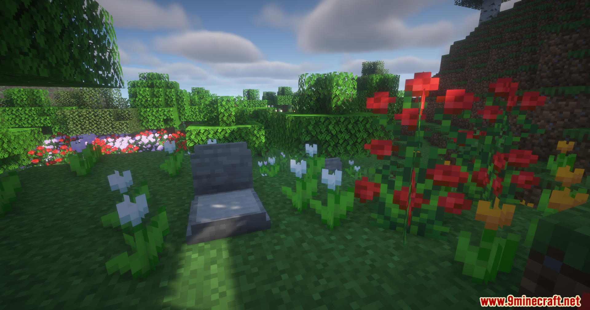 Epitaphs Mod Screenshot 10 A stone grave surrounded by colorful flowers in a sunny Minecraft field