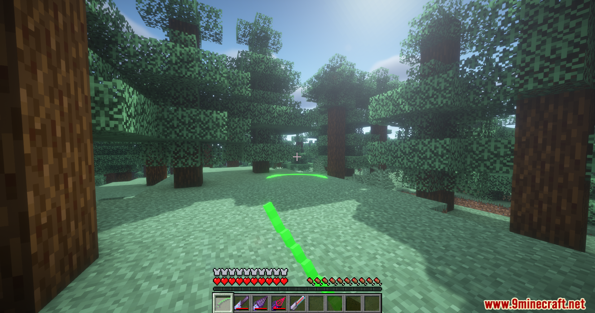 Extended Industrialization Mod Screenshot 14 First person view of a player holding a green laser in a forest