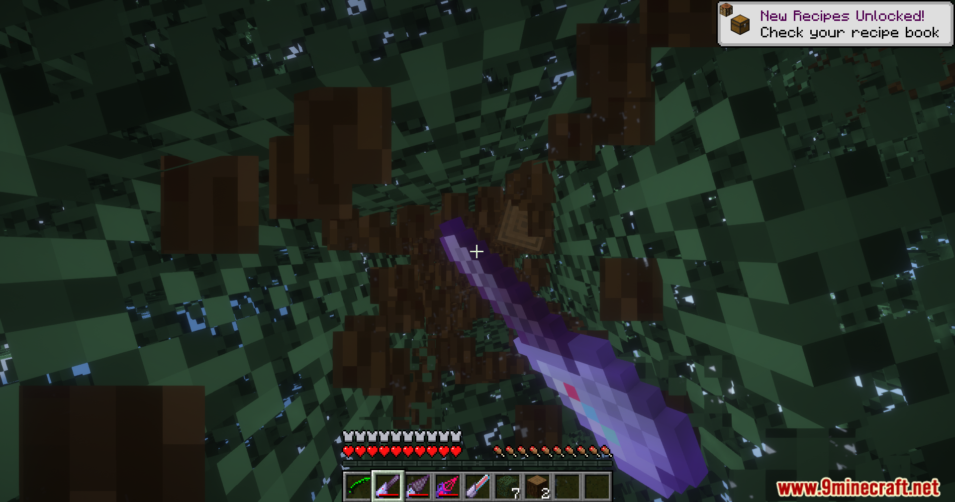 Extended Industrialization Mod Screenshot 15 A player holding a purple electric drill while looking up at tree leaves
