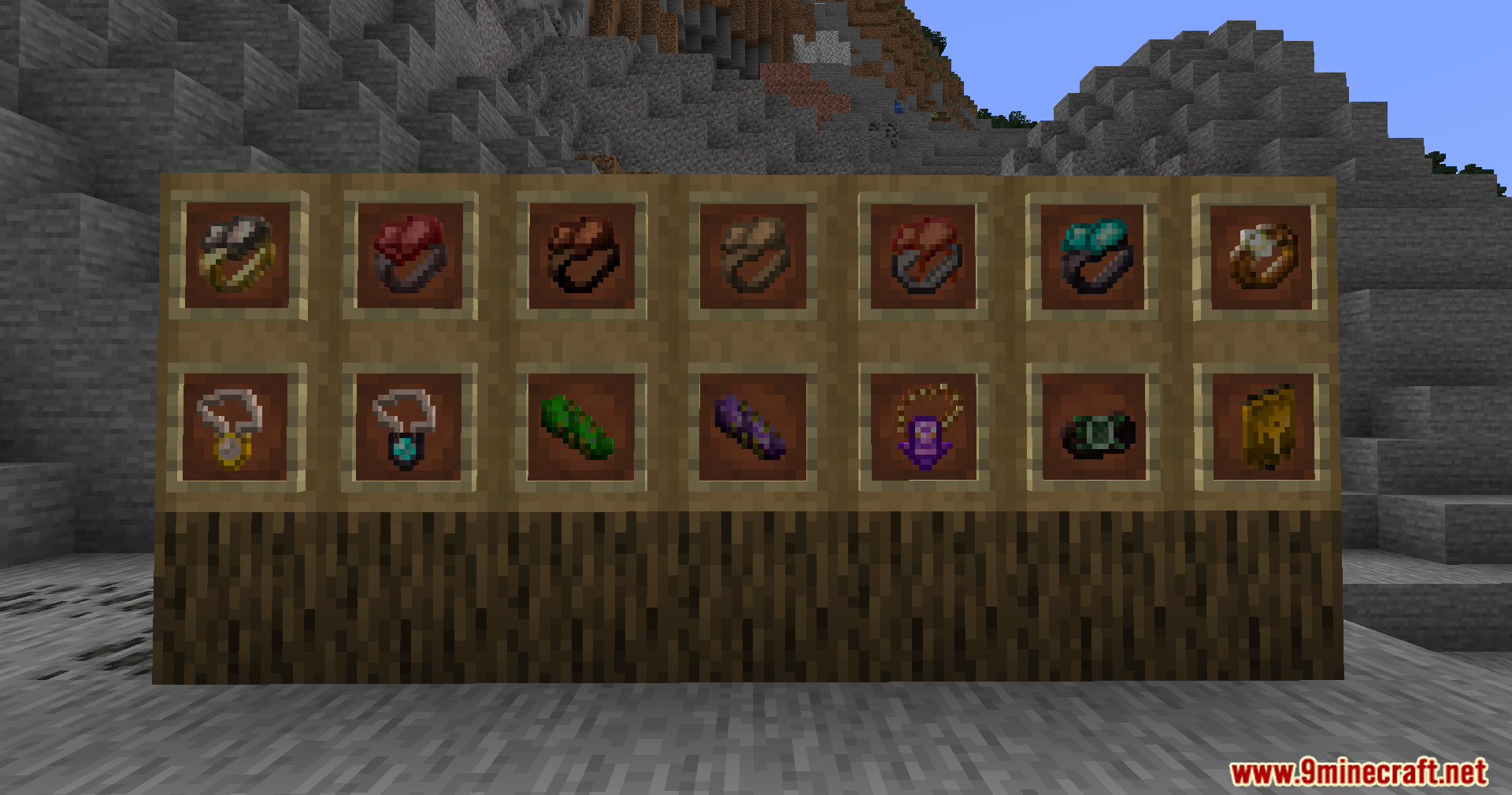 Extra Spell Attributes Mod Screenshot 2 Various magical rings and amulets displayed in item frames on a wooden wall