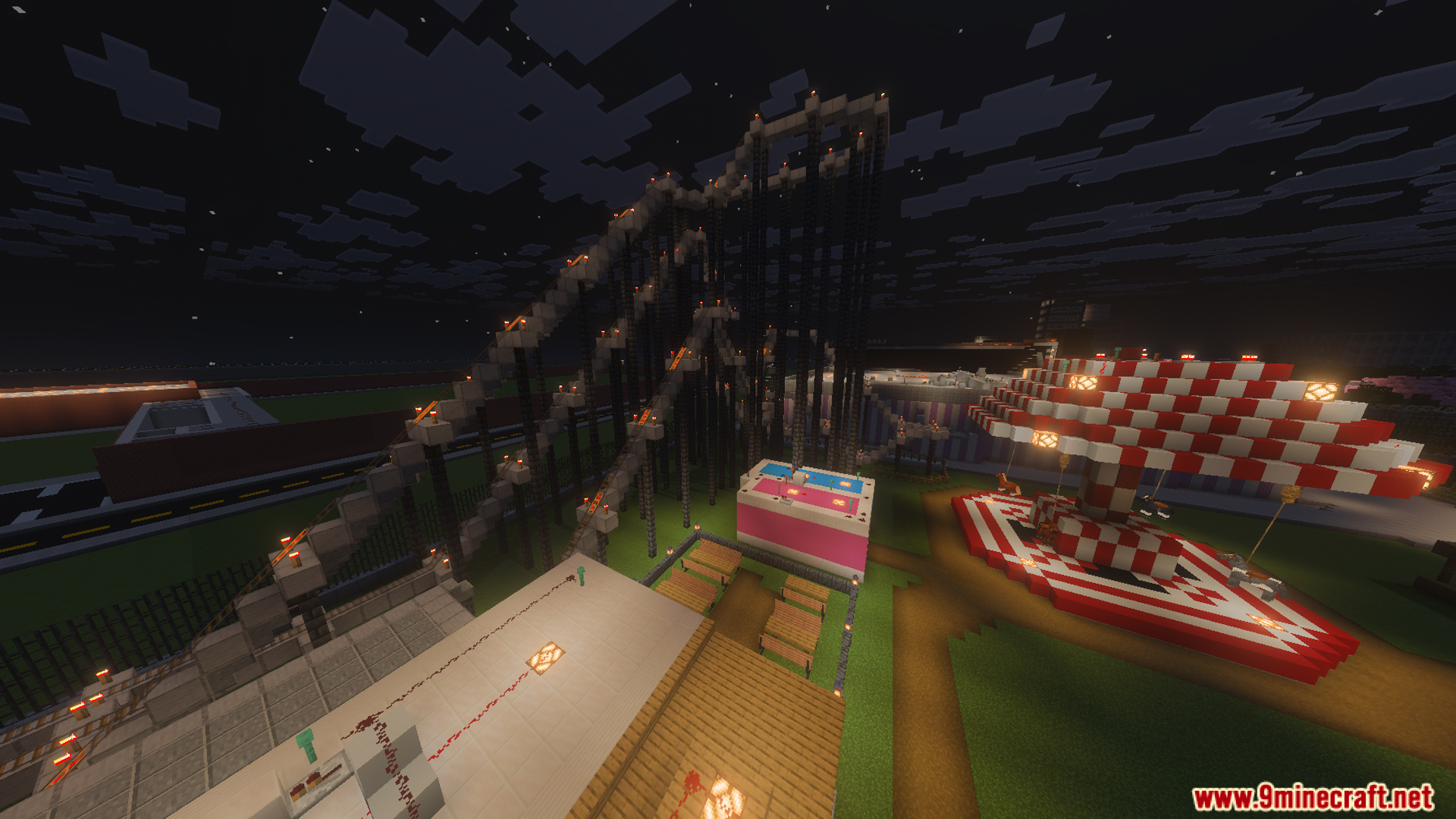 A large roller coaster and carousel at night in the FNaF Silvia Map