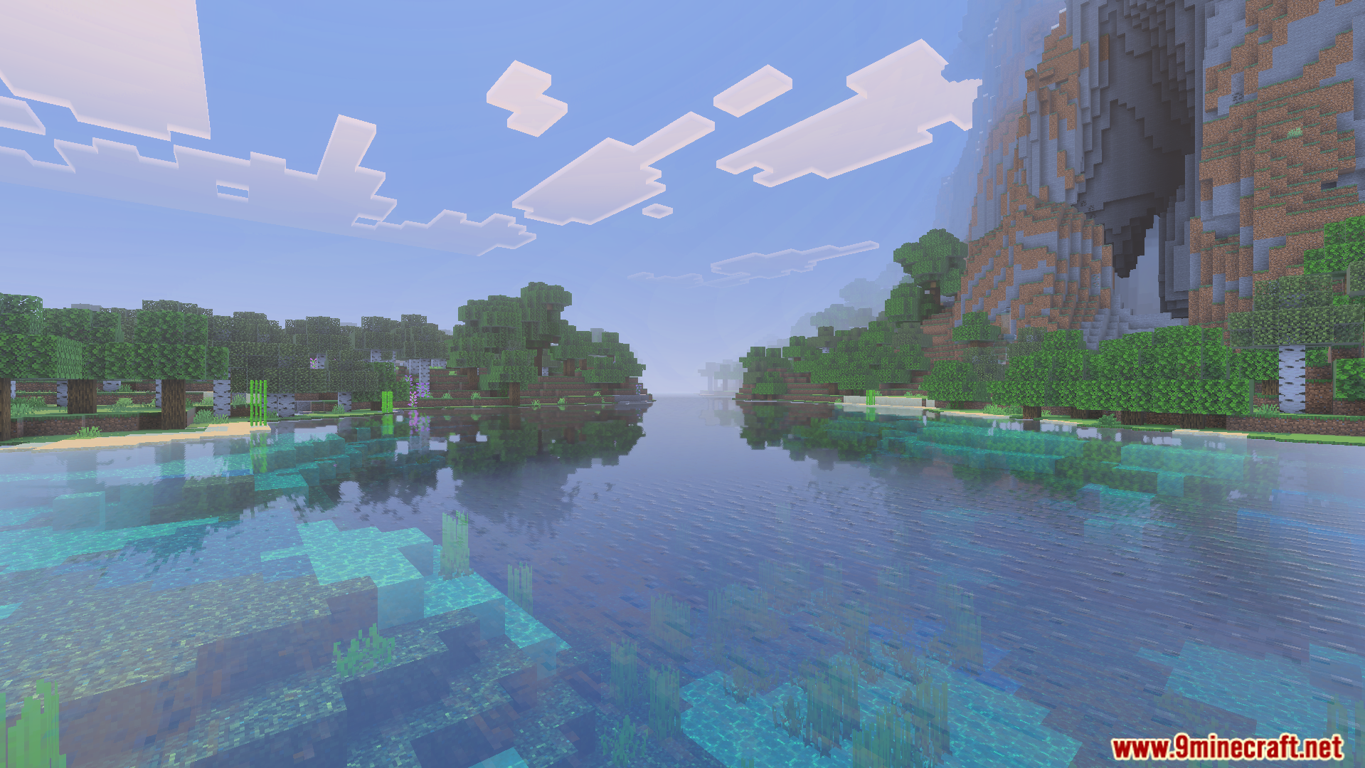 A peaceful river scene in Minecraft with green trees and a large mountain