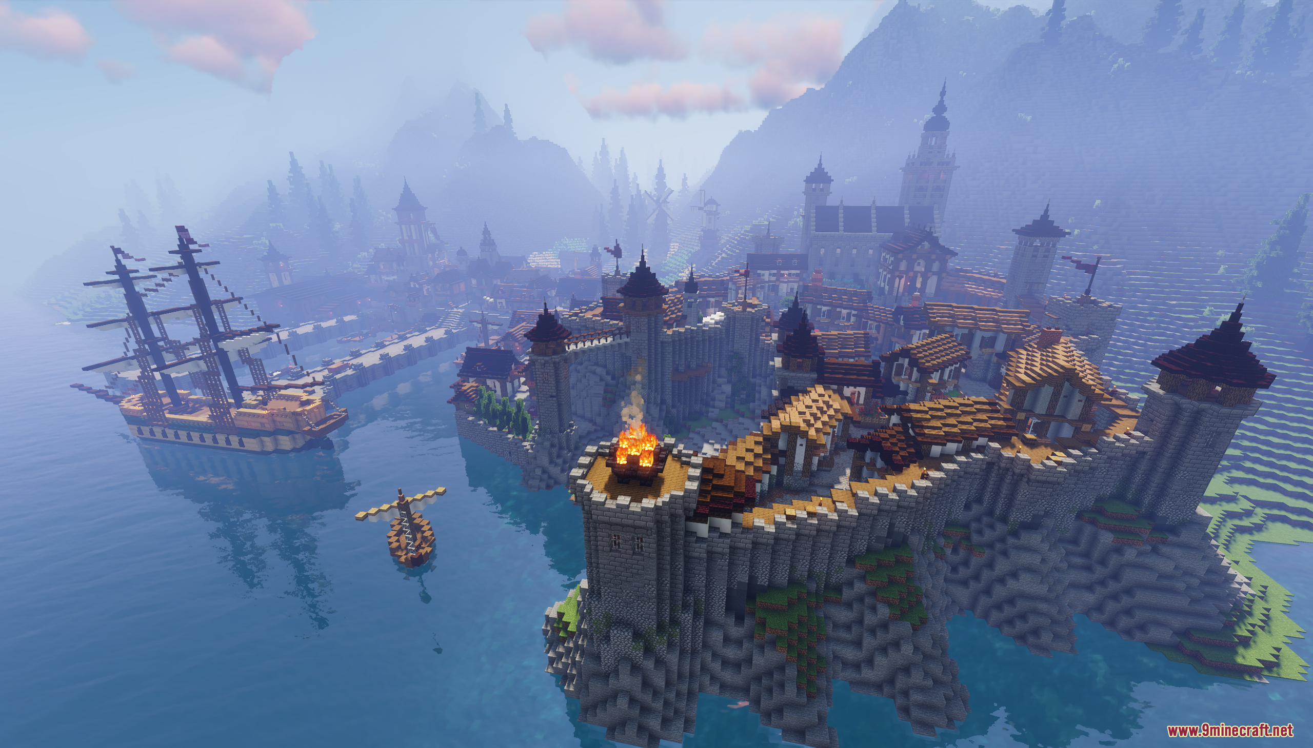 Aerial view of a fortified coastal city with stone walls and defensive towers