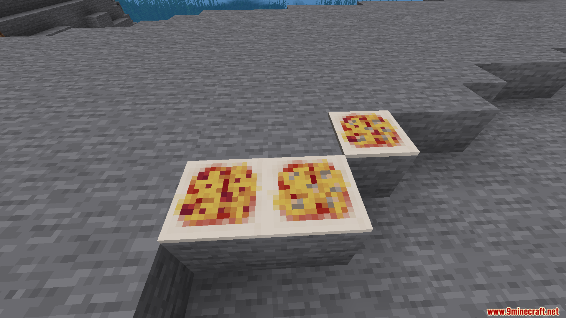 Farmers Pizzeria Mod Screenshot 3 Three different types of pizzas placed on stone blocks in the world