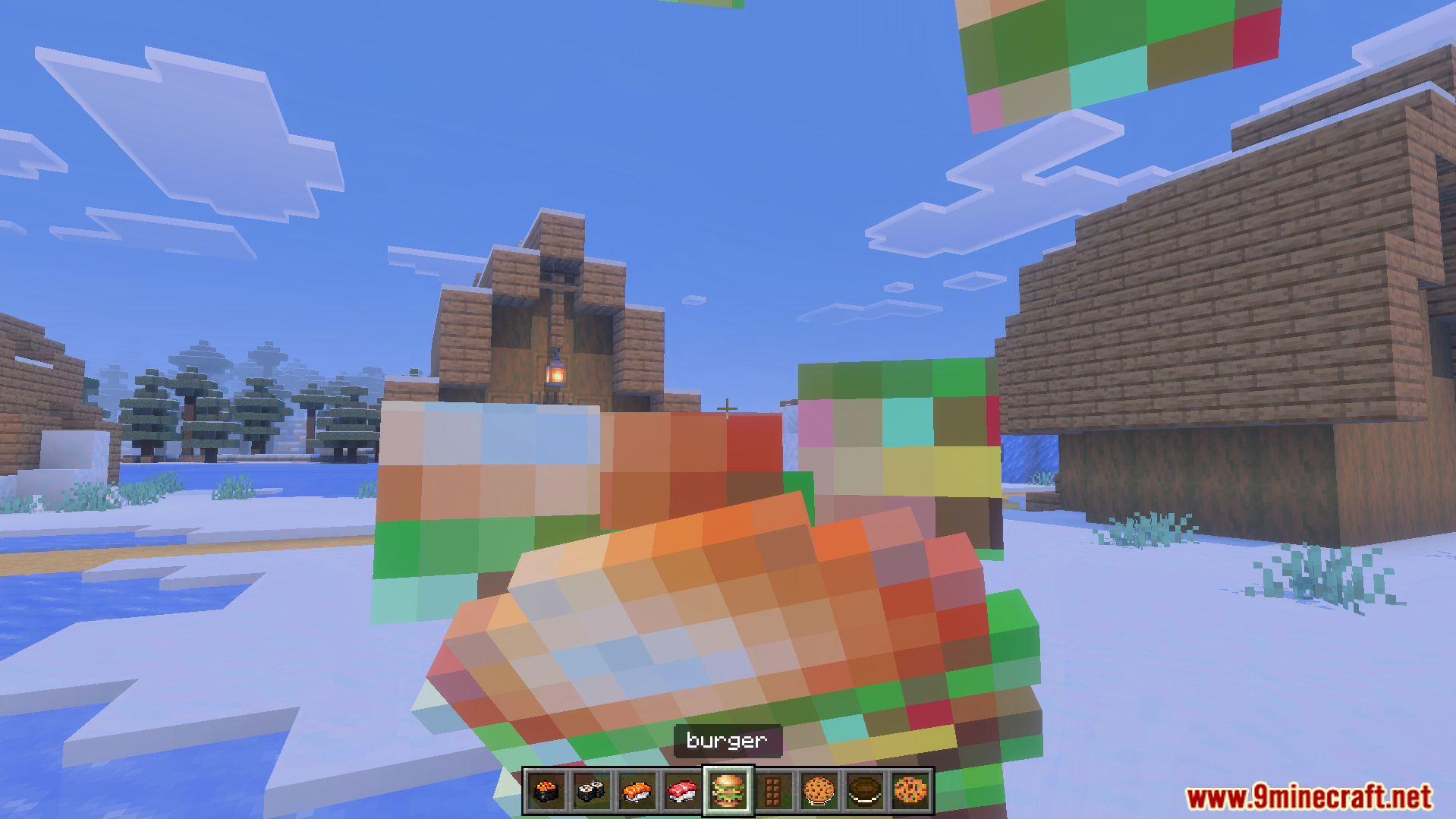 First person view of a player holding a burger in snowy village