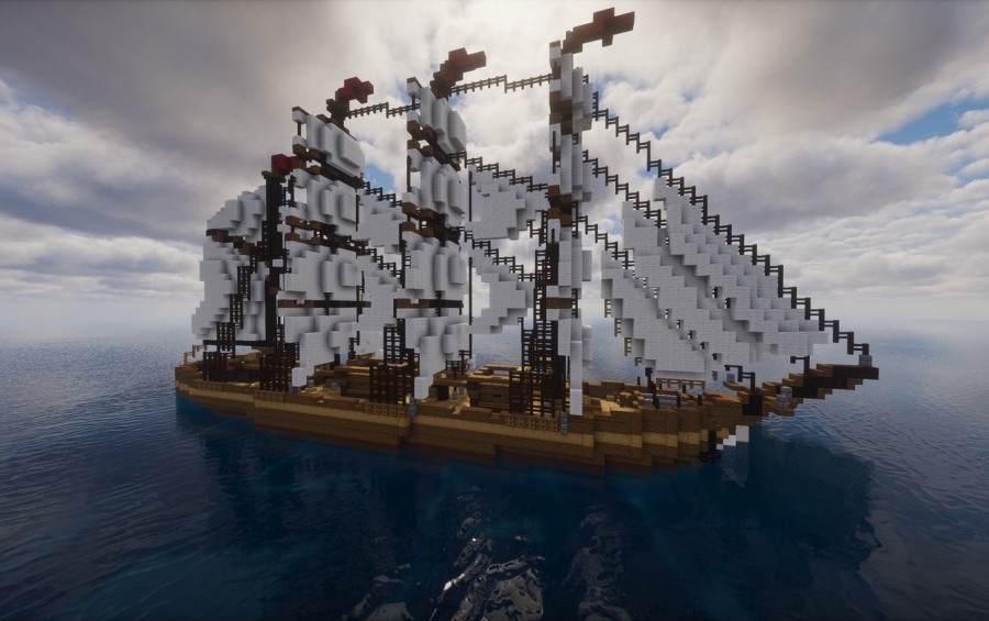 Side view of a majestic four masted wooden ship on the open sea