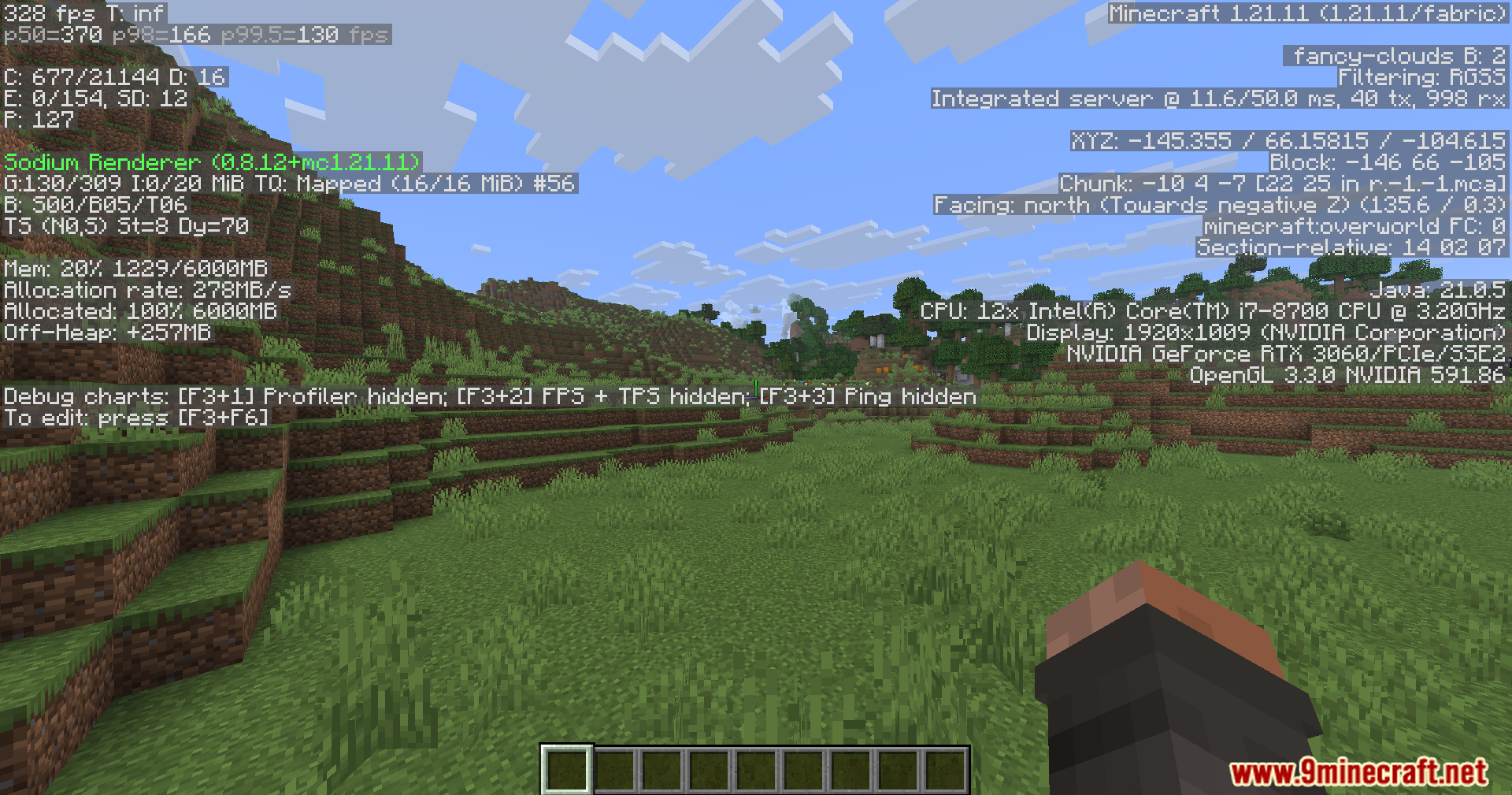 Player looking at green hills with debug performance data displayed