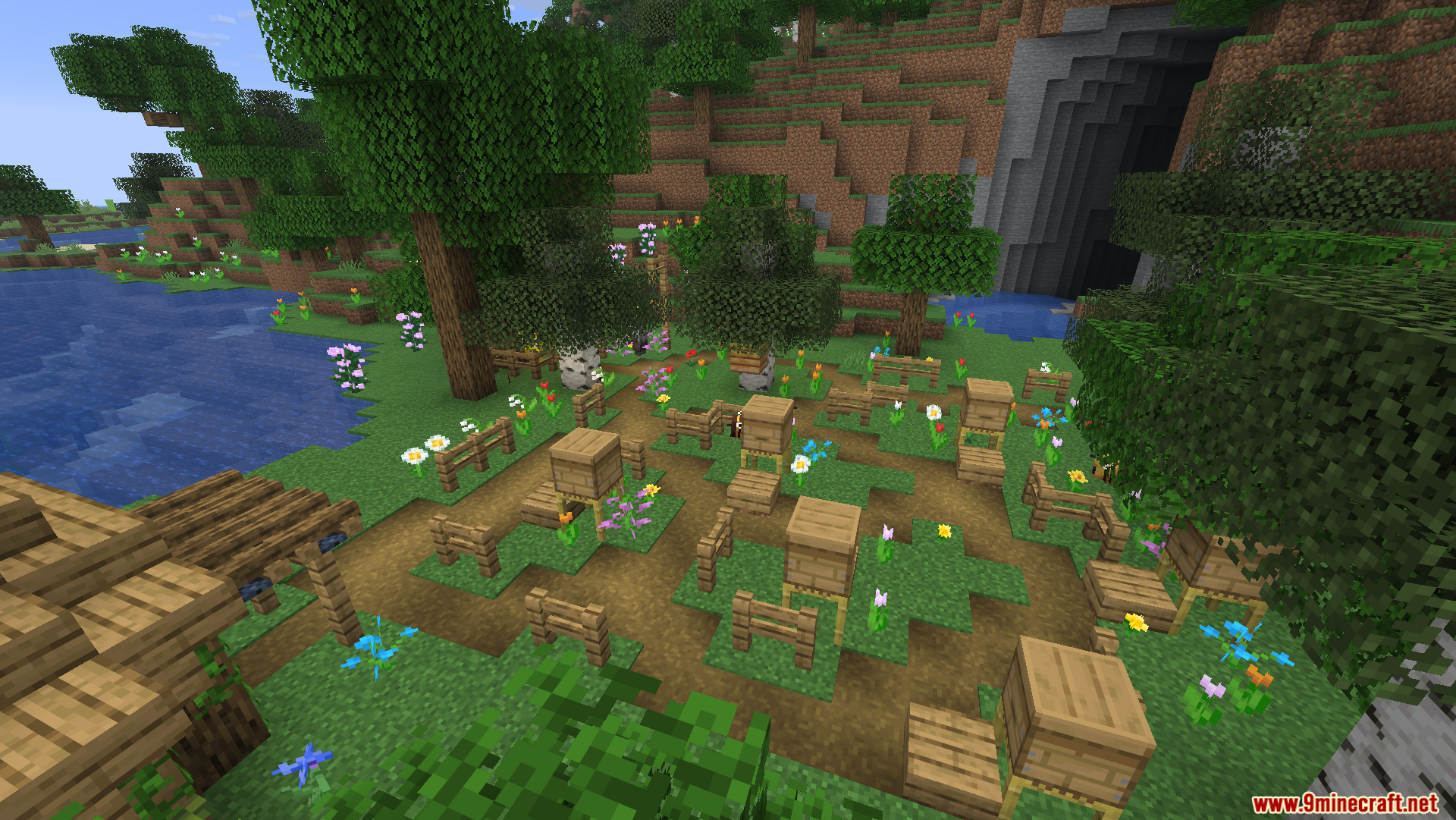 Friends N Foes Beekeeper Hut Mod Screenshot 7 A beekeeping farm with wooden hives and flowers near a dark cave