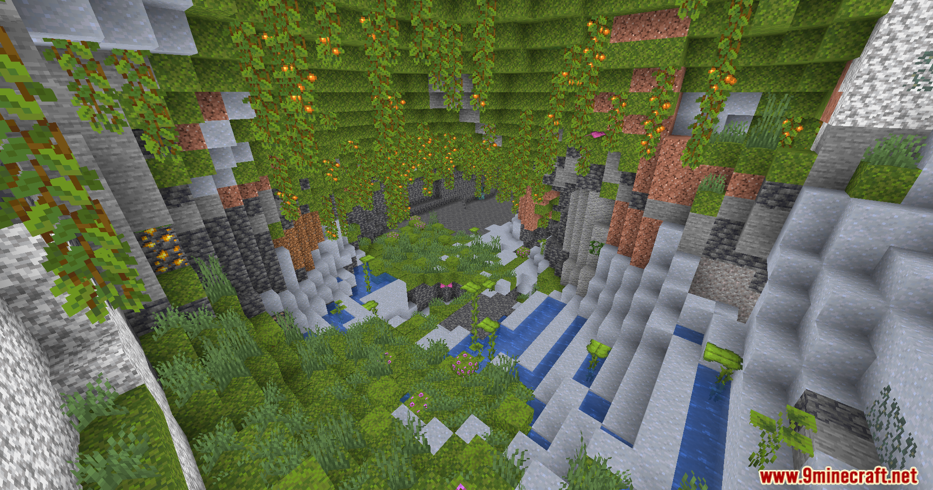 Lush cave biome filled with green moss and hanging glow berries and water
