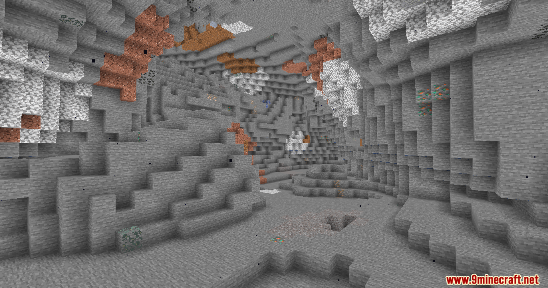 A brightly lit cave showing copper ore and various stone types