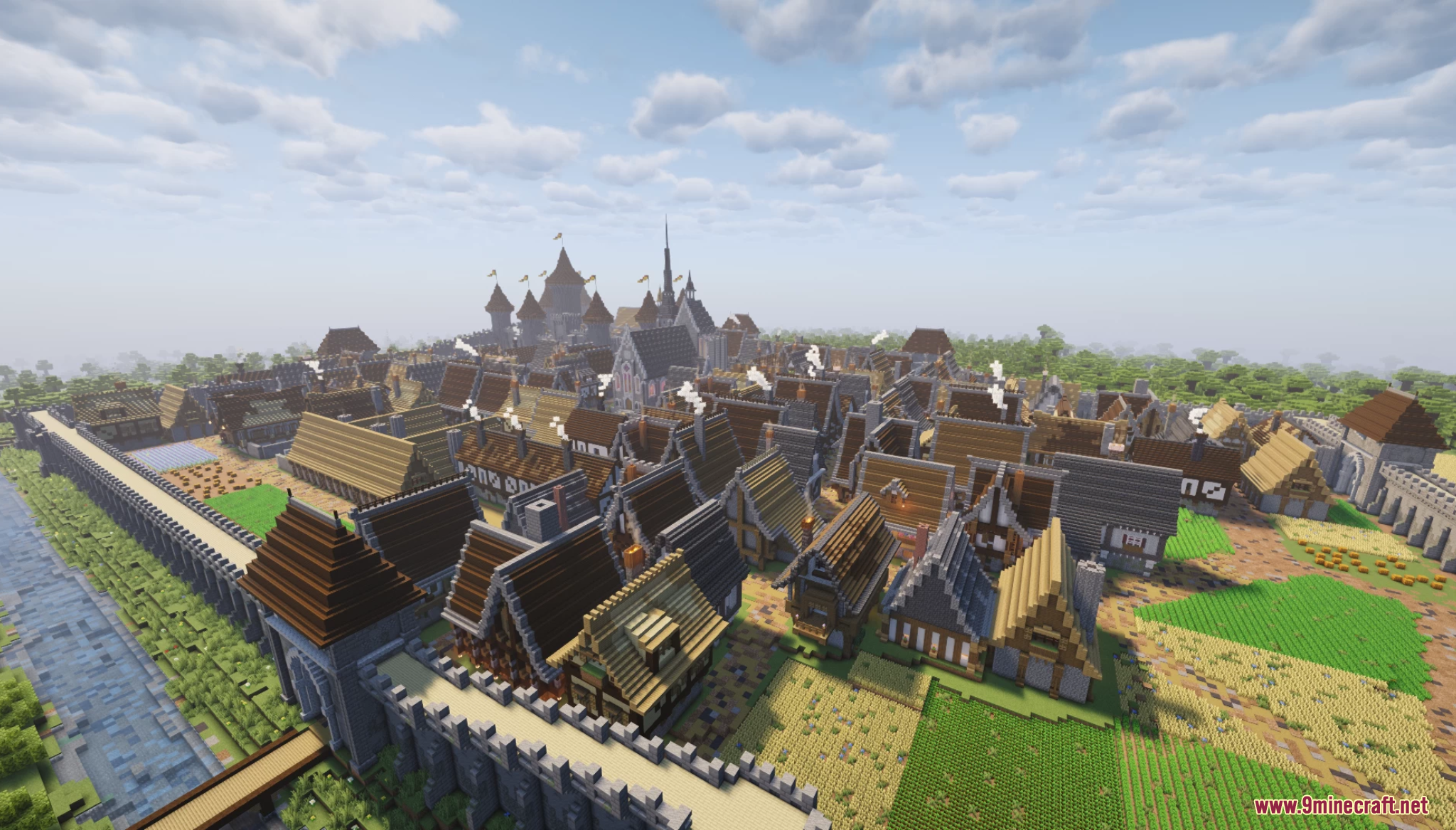 A sprawling medieval village with stone walls and many wooden houses