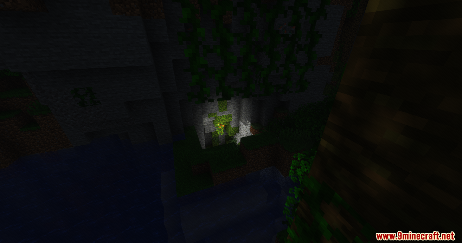 GlamorousSP Shaders Screenshot 3 GlamorousSP Shaders displays a dark cave entrance with hanging green vines
