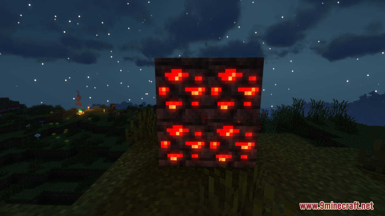 A close up of glowing redstone ore blocks under a starry sky