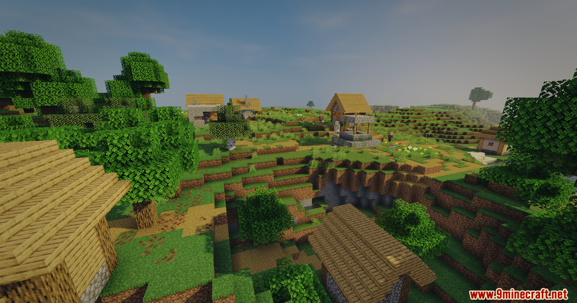 A scenic Minecraft village with wooden houses and trees under bright sunlight