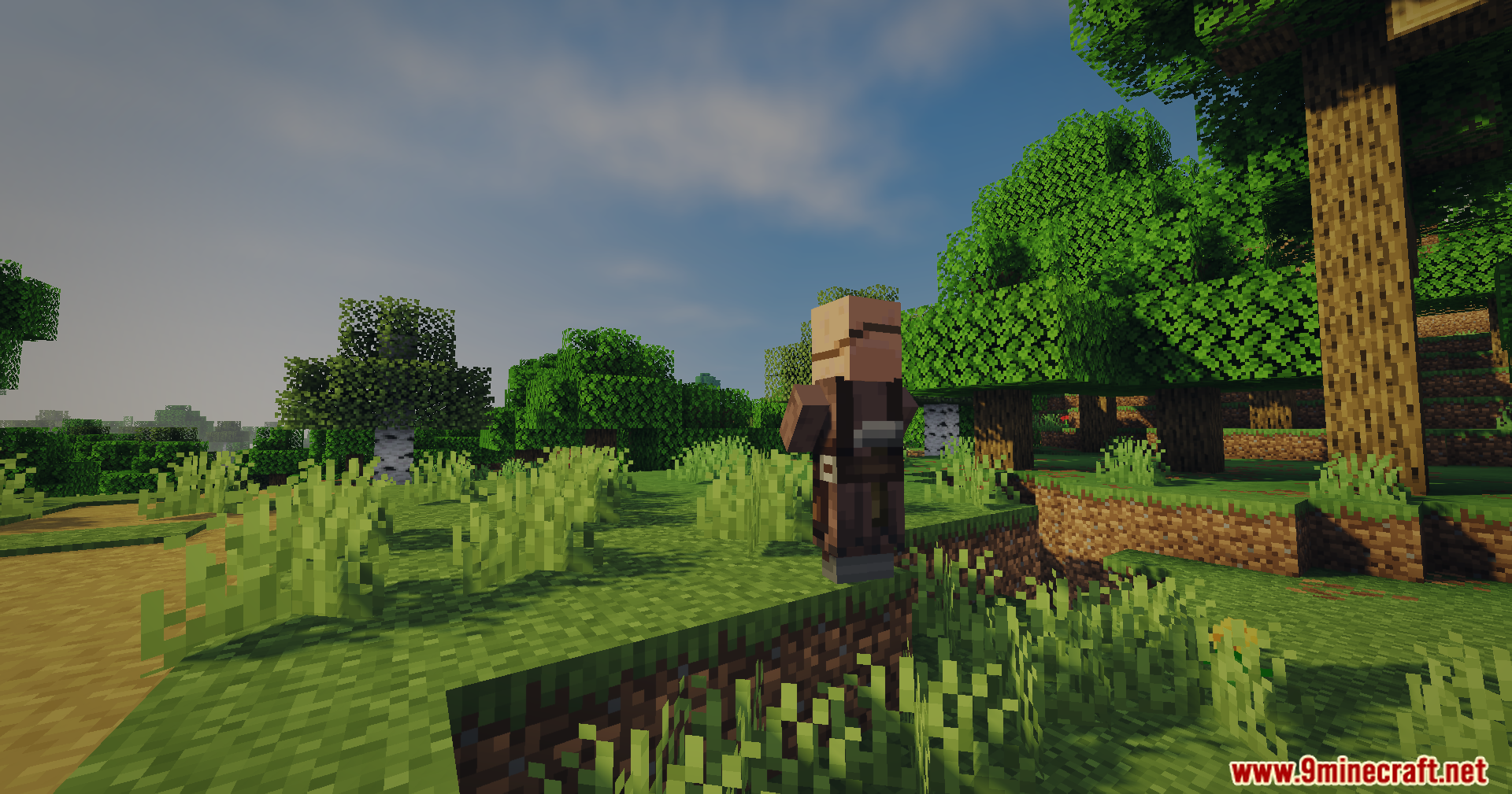 A villager stands on a grassy hill with soft lighting and green trees